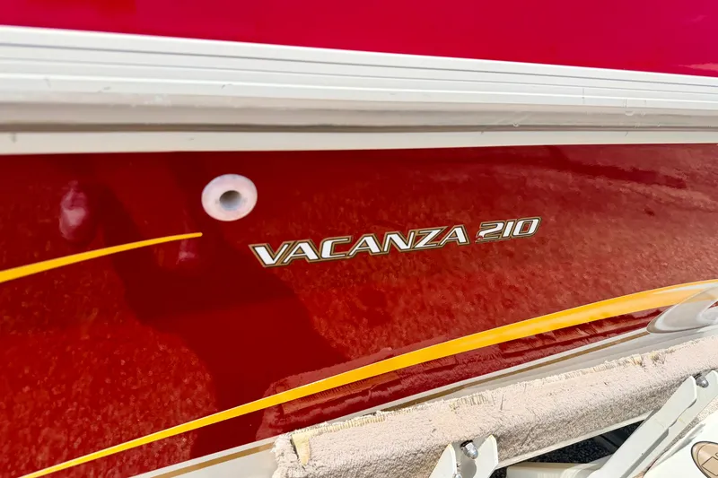 Slide: The Image of Red 2005 Princecraft Vacanza 210V O/B boat with sleek yellow accents. - 9