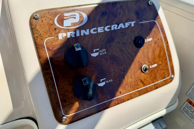 Slide: The Image of Control panel of a 2005 Princecraft Vacanza 210V O/B boat with wood finish. - 37