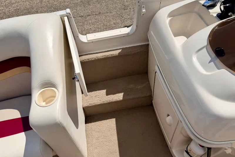 Slide: The Image of Interior view of a 2005 Princecraft Vacanza 210V O/B boat, featuring seating and steps. - 54