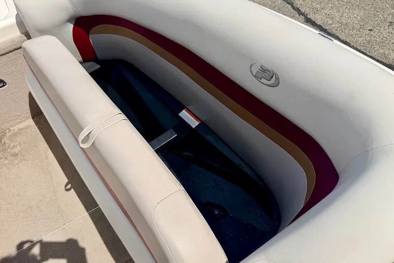 Slide: The Image of 2005 Princecraft Vacanza 210V O/B boat interior with cushioned seating and storage compartment. - 47