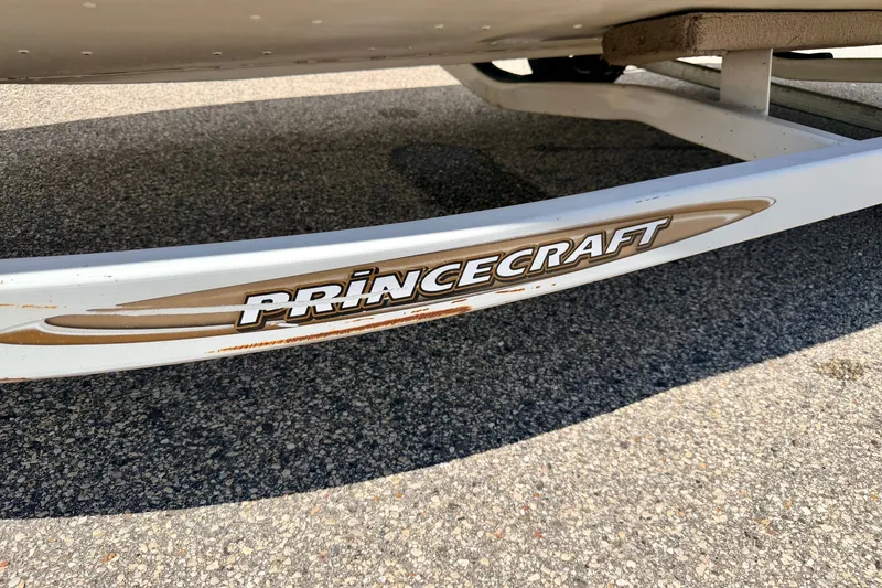 Slide: The Image of 2005 Princecraft Vacanza 210V O/B boat trailer on asphalt surface. - 69