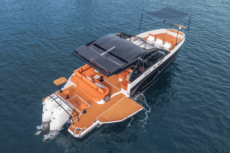 Slide: The Image of Luxury Hanover 387 yacht, 2026 model, cruising on open water with sleek design. - 0