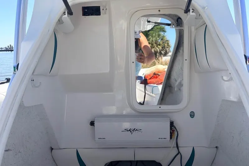 Slide: The Image of 2018 Glasstream 280 Pro-XS boat interior with Skar audio system, reflecting outdoor scenery. - 14