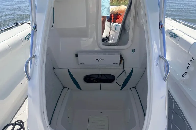 Slide: The Image of 2018 Glasstream 280 Pro-XS boat interior with seating and audio equipment. - 13