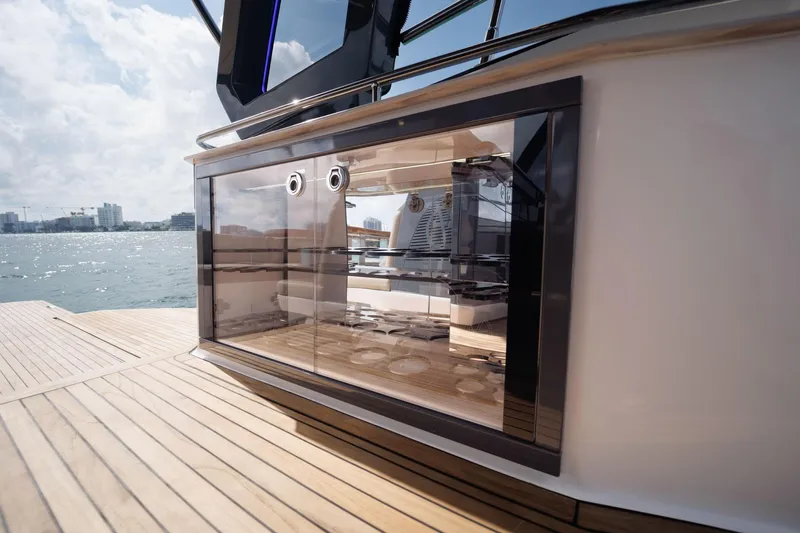 Slide: The Image of Luxury yacht Hanover 447 (2026) with sleek glass cabinetry, docked by the waterfront. - 38