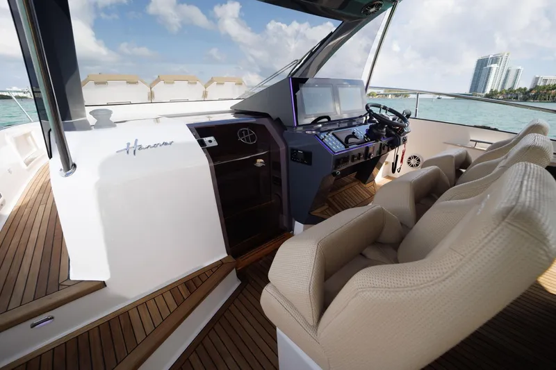 Slide: The Image of Luxurious Hanover 447 yacht cockpit with modern controls, plush seating, and ocean view, 2026 model. - 40