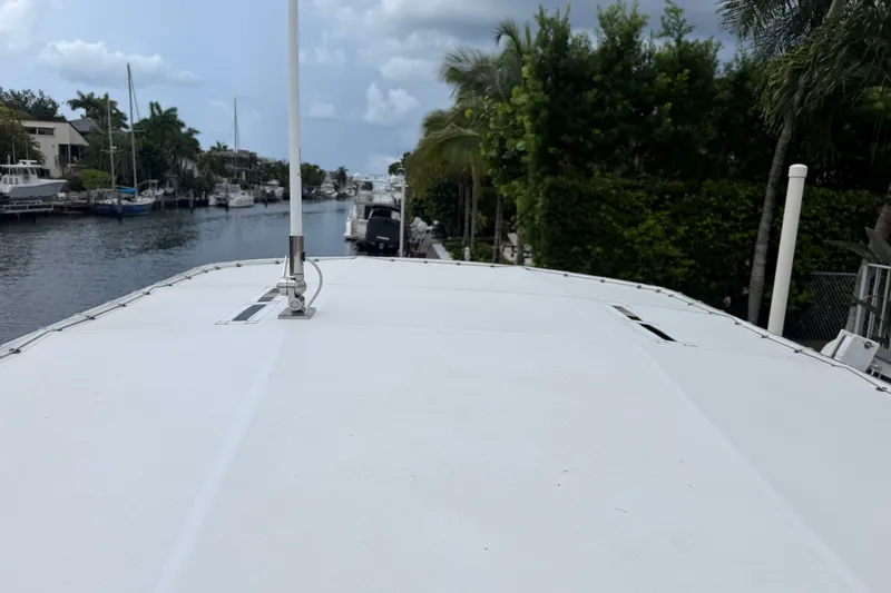 Slide: The Image of 2015 Pathfinder 2200 V Tournament Edition boat docked by a scenic canal. - 10