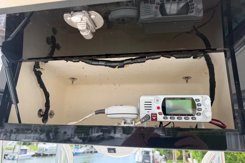 Slide: The Image of 2015 Pathfinder 2200 V Tournament Edition boat console with marine radio equipment. - 12