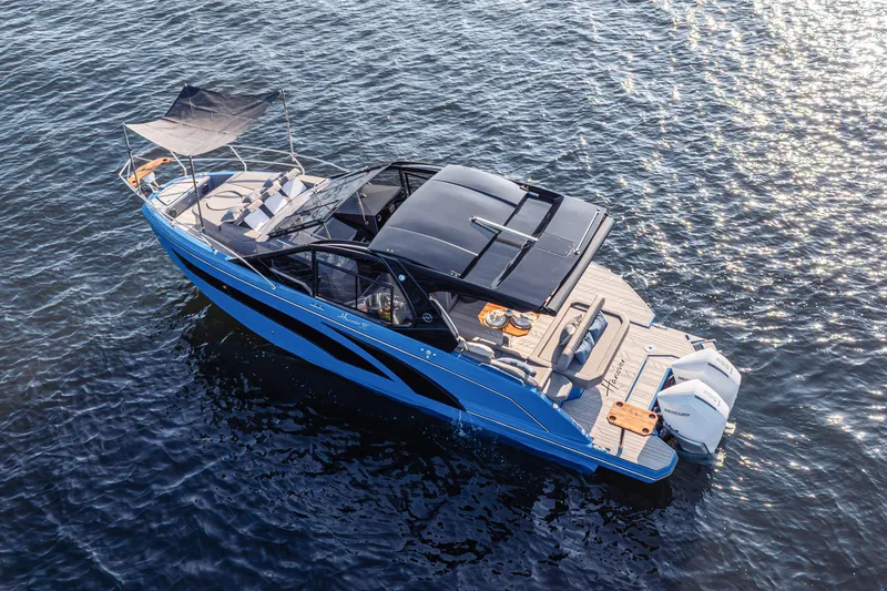 Slide: The Image of 2026 Hanover 347 boat on water, featuring sleek design and modern amenities. - 5