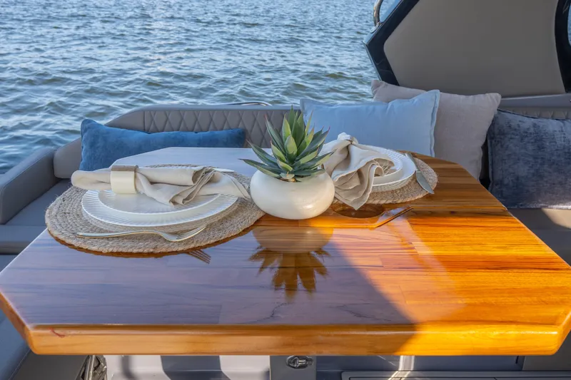 Slide: The Image of Luxurious Hanover 347 yacht dining setup with elegant tableware and cushions, 2026 model. - 25