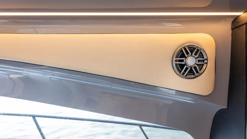 Slide: The Image of Close-up of a speaker in a modern boat, surrounded by sleek surfaces. - 30