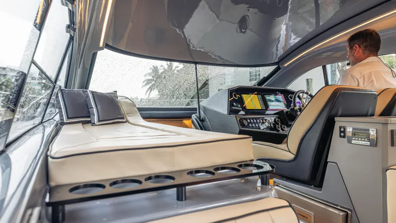 Slide: The Image of The image shows the interior of a modern boat with a sleek cockpit and comfortable seating. - 24