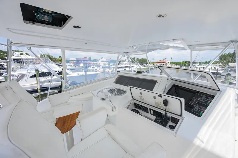 Slide: The Image of Interior view of a 2001 Viking 55 Convertible yacht cockpit with modern controls and seating. - 30
