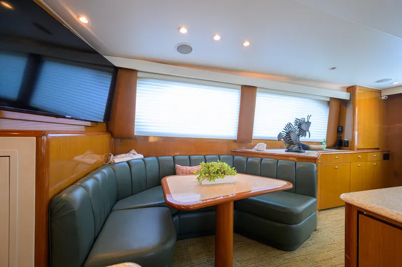Slide: The Image of Luxurious interior of 2001 Viking 55 Convertible yacht with plush seating and elegant decor. - 52