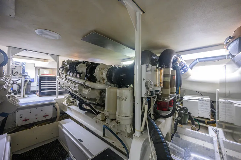 Slide: The Image of Engine room of a 2001 Viking 55 Convertible yacht, showcasing machinery and equipment. - 78