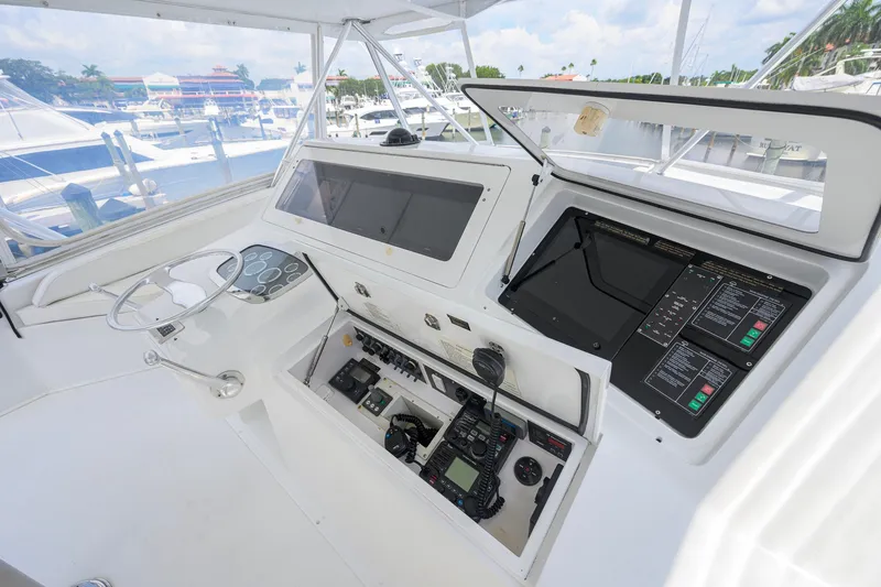 Slide: The Image of Control panel of a 2001 Viking 55 Convertible yacht at a marina. - 31