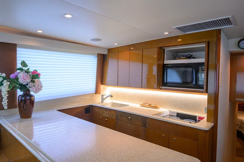 Slide: The Image of Luxurious kitchen interior of 2001 Viking 55 Convertible yacht with modern amenities. - 49