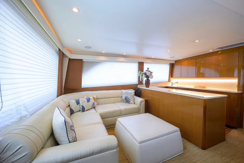 Slide: The Image of Luxurious interior of 2001 Viking 55 Convertible yacht with elegant seating and modern kitchen. - 41
