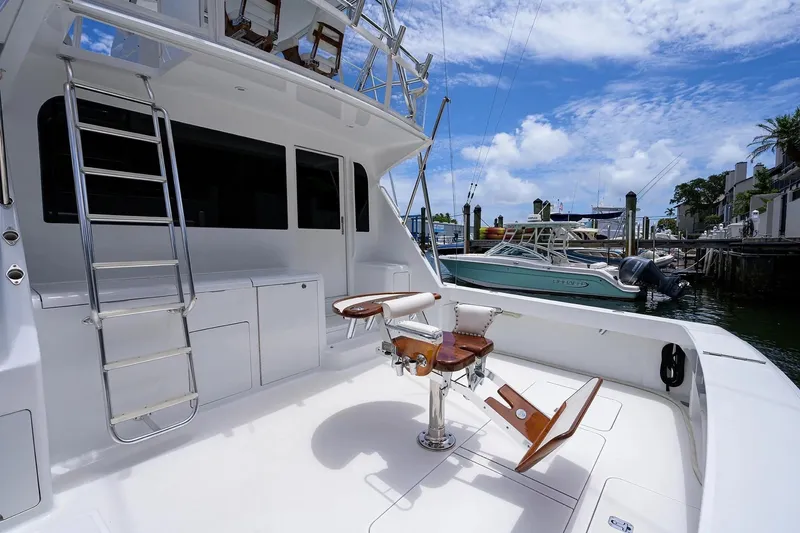 Slide: The Image of 2001 Viking 55 Convertible yacht with fishing chair and ladder, docked at marina. - 19