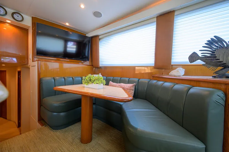 Slide: The Image of Luxurious interior of a 2001 Viking 55 Convertible yacht with plush seating and modern decor. - 51