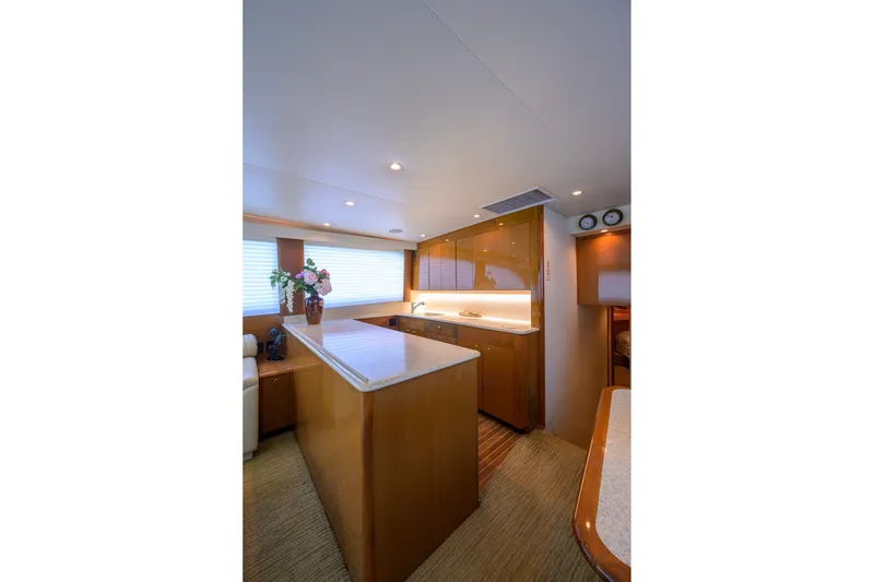 Slide: The Image of Luxurious interior of 2001 Viking 55 Convertible yacht kitchen with modern design. - 48