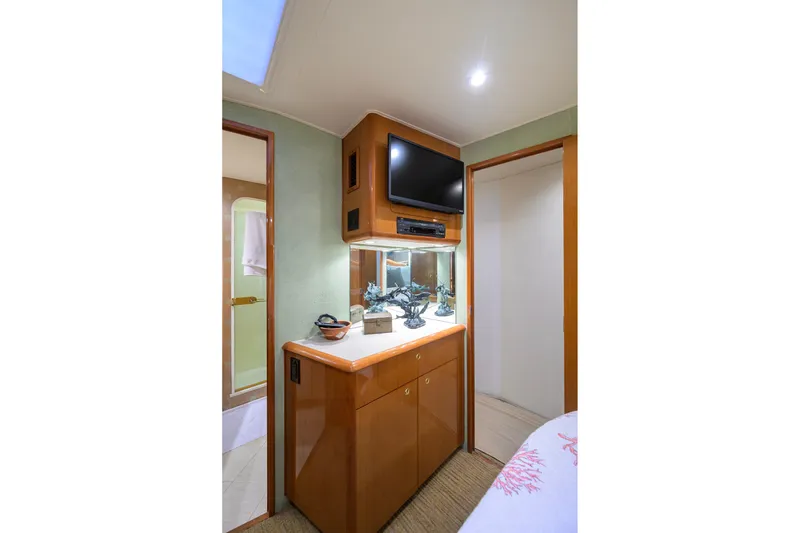 Slide: The Image of Interior of 2001 Viking 55 Convertible yacht with TV and cabinetry. - 59