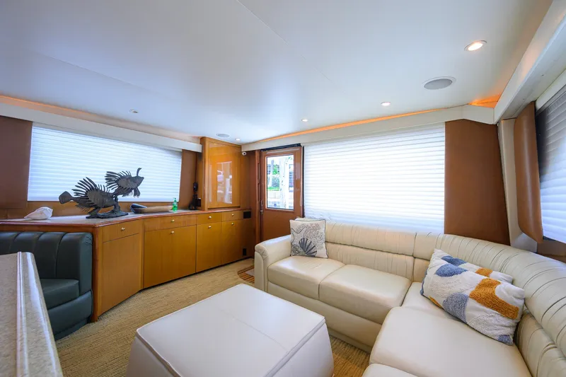 Slide: The Image of Luxurious interior of 2001 Viking 55 Convertible yacht with plush seating and elegant decor. - 44