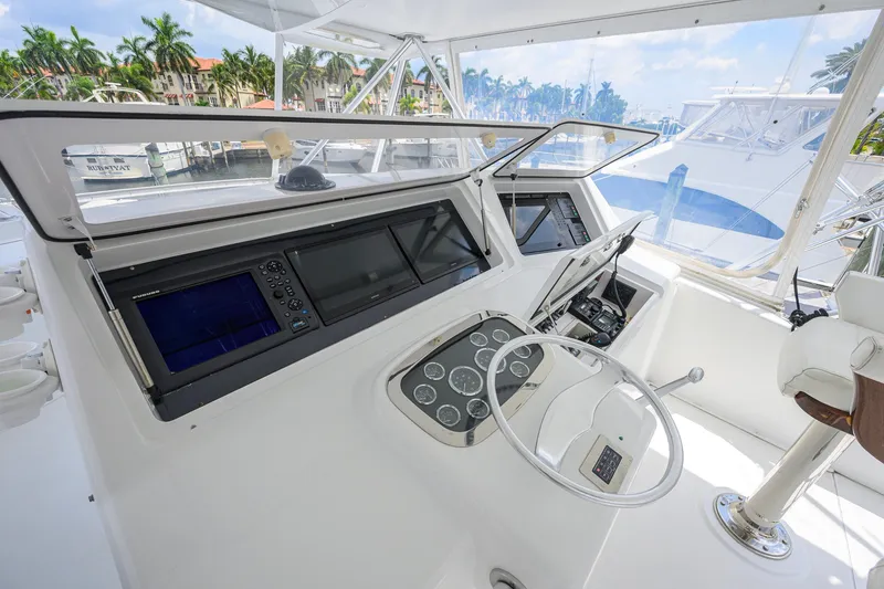 Slide: The Image of Helm of 2001 Viking 55 Convertible yacht with modern navigation equipment. - 28