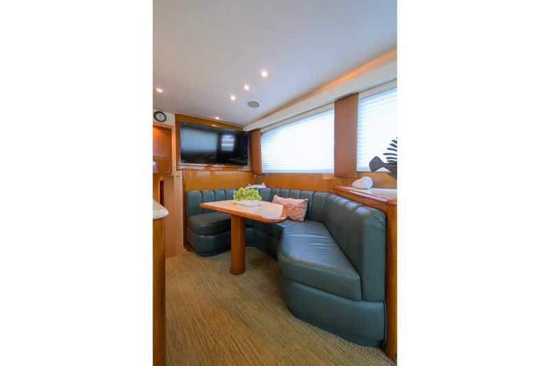 Slide: The Image of Luxurious interior of 2001 Viking 55 Convertible yacht with plush seating and modern decor. - 50