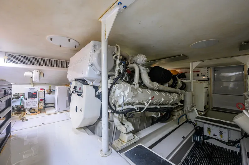 Slide: The Image of Engine room of a 2001 Viking 55 Convertible yacht, showcasing machinery and equipment. - 83