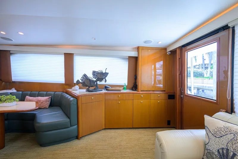 Slide: The Image of Luxurious interior of a 2001 Viking 55 Convertible yacht with elegant wood cabinetry. - 53