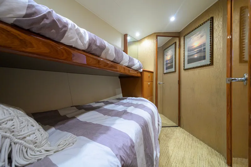 Slide: The Image of Interior of 2001 Viking 55 Convertible yacht with cozy bunk beds and elegant decor. - 70