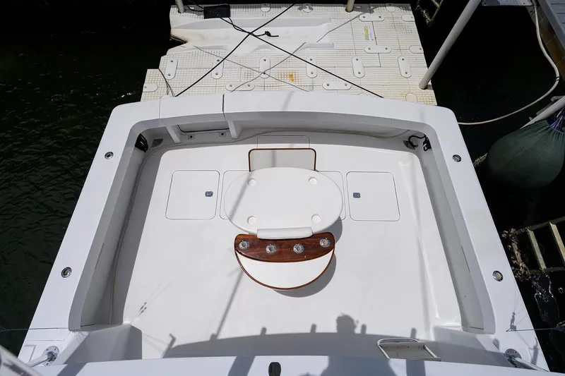 Slide: The Image of 2001 Viking 55 Convertible yacht cockpit with fishing chair and storage compartments. - 17