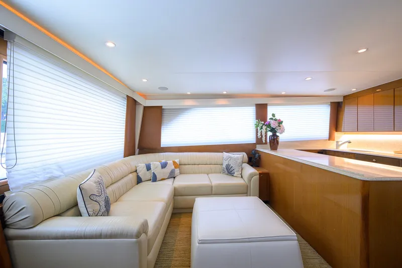 Slide: The Image of Luxurious interior of 2001 Viking 55 Convertible yacht with plush seating and elegant decor. - 42