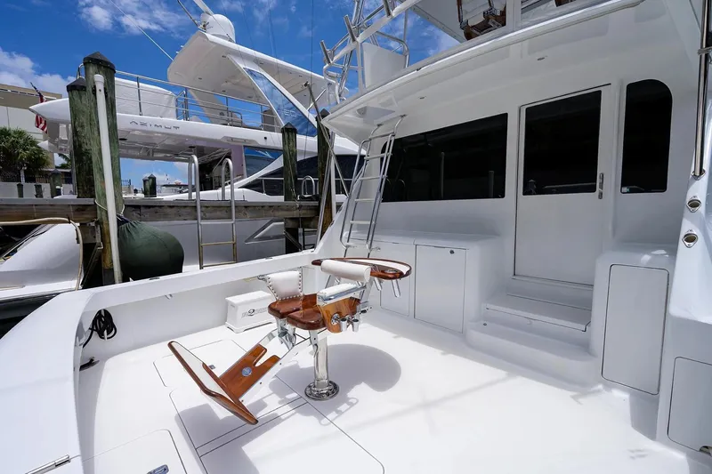 Slide: The Image of 2001 Viking 55 Convertible yacht deck with fishing chair and ladder. - 20