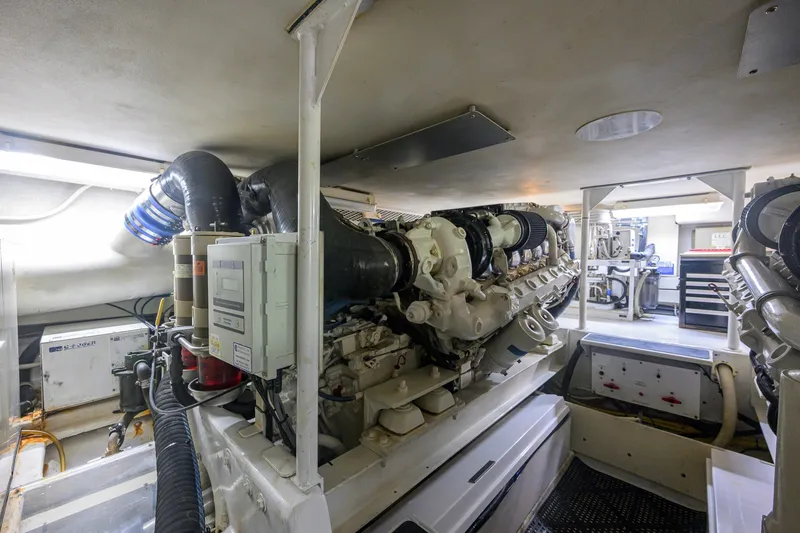 Slide: The Image of Engine room of a 2001 Viking 55 Convertible yacht, showcasing machinery and equipment. - 80