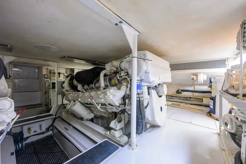 Slide: The Image of Engine room of a 2001 Viking 55 Convertible yacht, showcasing machinery and equipment. - 86
