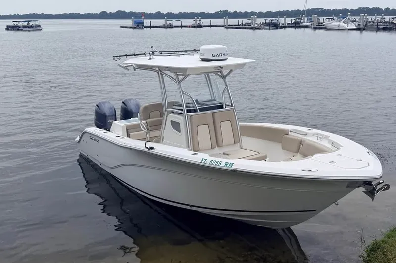 Slide: The Image of 2018 Sea Fox 266 Commander boat docked on calm waters. - 3