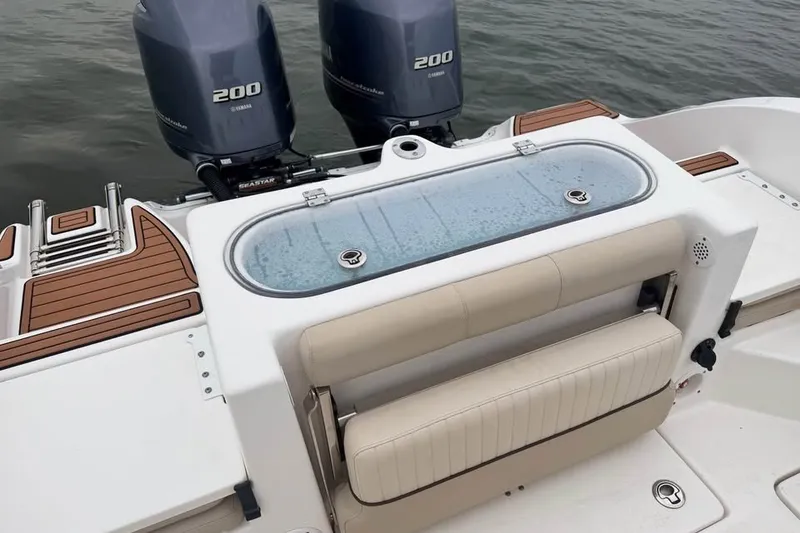 Slide: The Image of 2018 Sea Fox 266 Commander boat with twin Yamaha 200 engines and seating area. - 5