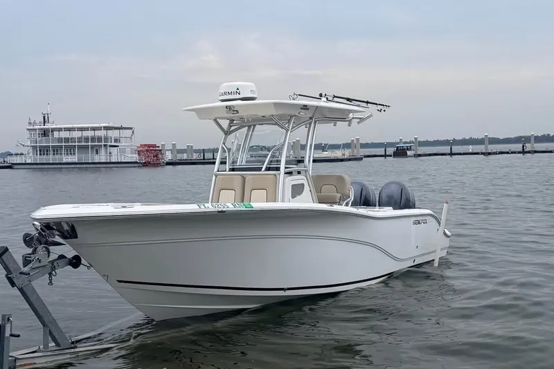 The Image of 2018 Sea Fox 266 Commander boat docked on calm waters. - 2