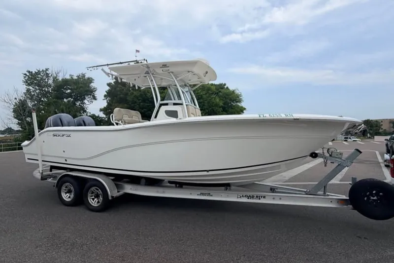 Slide: The Image of 2018 Sea Fox 266 Commander boat on trailer, parked outdoors. - 1