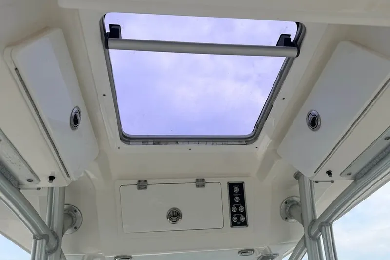 Slide: The Image of Interior view of 2018 Sea Fox 266 Commander boat's ceiling with hatch and storage compartments. - 10