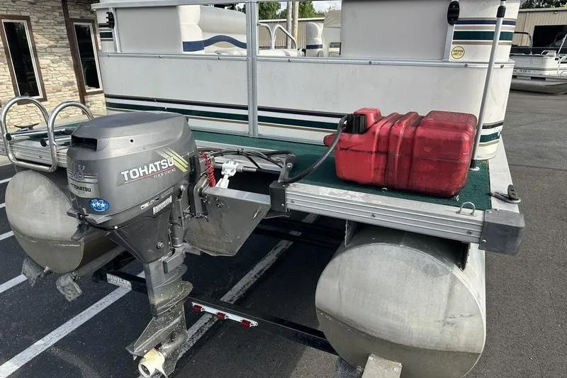 Slide: The Image of 1999 Starcraft Starfish 180 pontoon boat with Tohatsu outboard motor and red fuel tank. - 10