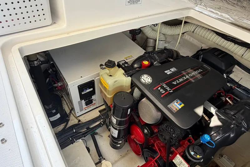 Slide: The Image of Engine compartment of a 2015 Rinker 340 Express Cruiser with Volvo Penta engine. - 38