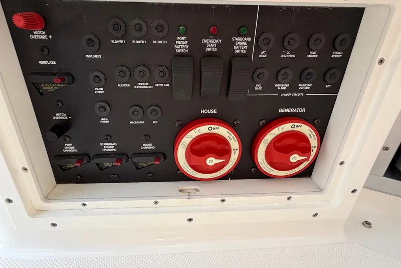 Slide: The Image of Control panel of a 2015 Rinker 340 Express Cruiser with switches and dials. - 35