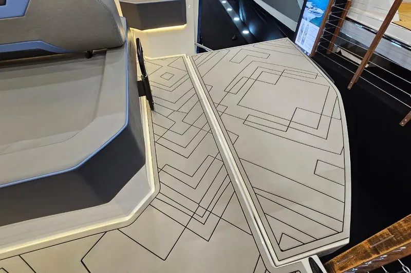 Slide: The Image of Modern Hanover 327 boat deck with geometric patterns, 2026 model. - 7