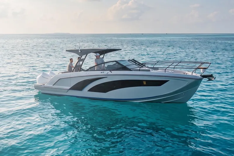 The Image of 2027 Hanover 327 boat cruising on clear blue ocean waters. - 0