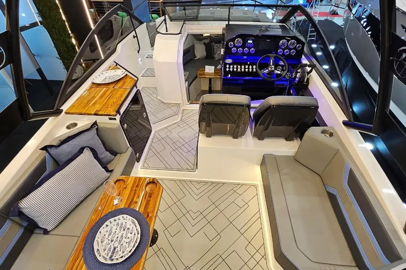 Slide: The Image of Luxurious interior of 2026 Hanover 327 boat with modern seating and elegant dining setup. - 11