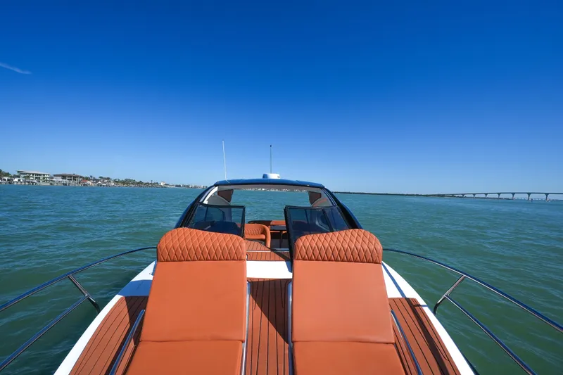 Slide: The Image of Luxurious Hanover 355 yacht cruising on open water, 2026 model, with elegant seating. - 7