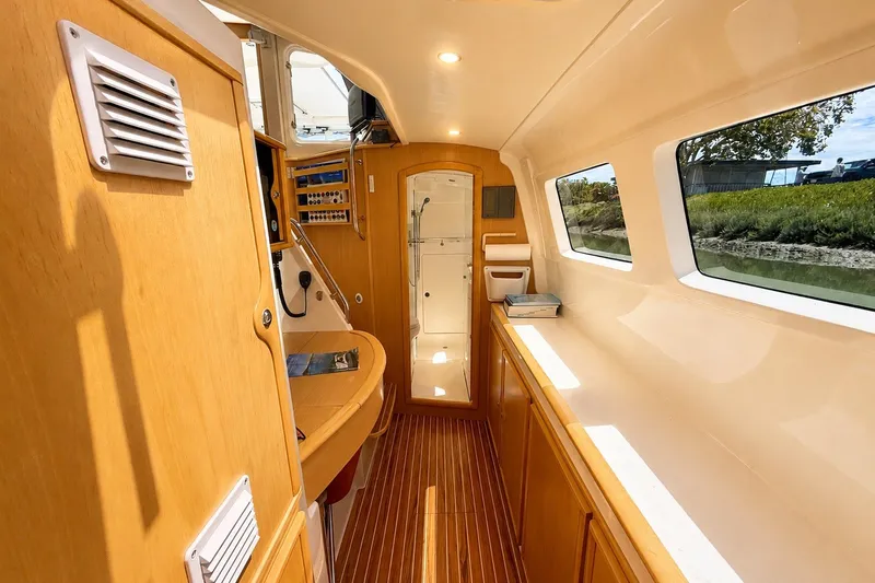 Slide: The Image of Looking aft in port hull with nav station and owner's private head - 22